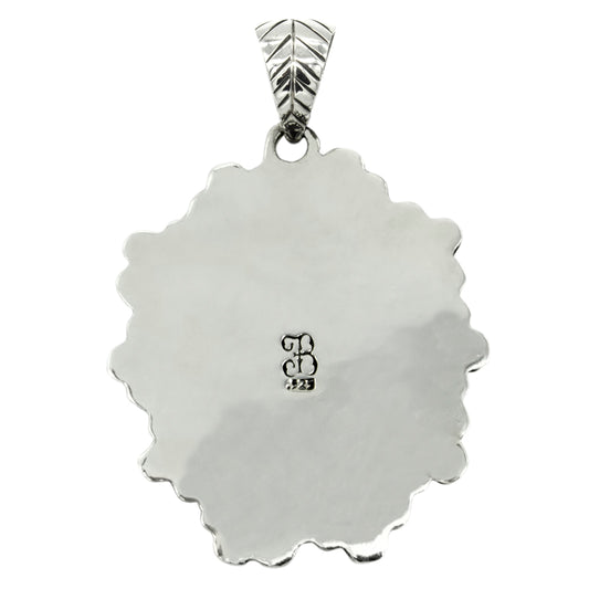 Dije calavera con flores con terminado vintage en plata de ley