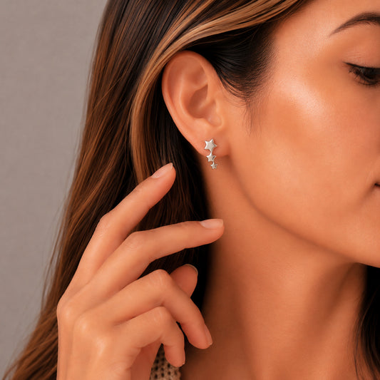 Aretes de estrella acabado liso en plata .925