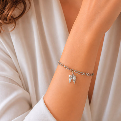 Charm de moño en plata de ley
